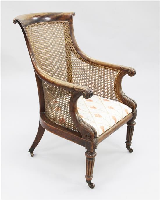 A George IV mahogany tub shape bergere armchair,